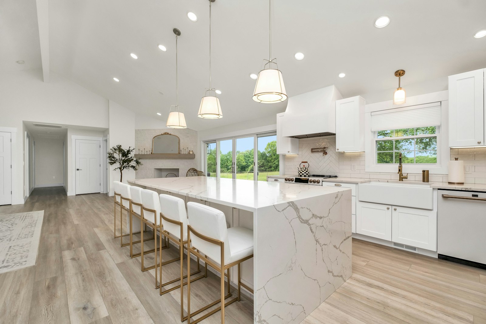 Bright, modern remodeled kitchen with a large marble island
